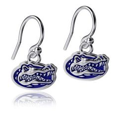 An adorable accessory to accentuate your love for the Florida Gators these Enamel dangle earrings will be the perfect complement to your game day ensemble. The cute team logo will directly match the logo on the rest of your Florida Gators gear, giving you a seamlessly supportive getup for all of the happenings on game day. Enamel graphics with debossed detail Stamped with a .925 sterling silver quality mark French earwire Imported Brand: Dayna Designs Platinum plated Drop length approx .5'' (fro Florida Jewelry, Football Earrings, Tin Gifts, Diy Kits Gift, Silver Enamel, Charm Gift, Beauty Accessories, Game Day