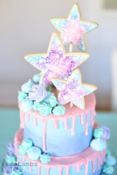 there is a cake decorated with stars and icing