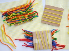 several pieces of crafting supplies laid out on a white surface with pins and thread