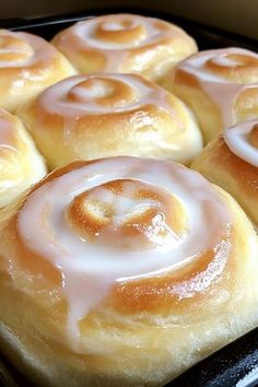 there are many cinnamon rolls in the pan