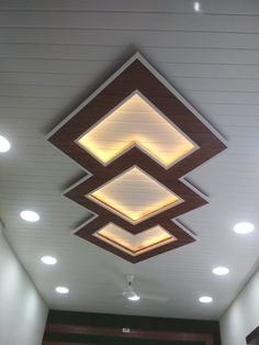 the ceiling is decorated with modern lighting fixtures