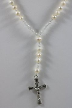 Thank you for looking at this listing!Up for sale is:Silver Tone 6mm Ringed Baroque Pearl Bead Y Necklace Cross Crucifix Catholic Christian Jesus PendantUsed, please see pictures for details on condition.I'm not an expert in rating condition, so please look carefully at the pictures and ask questions.What you see is what you get, sold As-Is.Shipping only within the United States. If you win multiple listings, I can combine shipping costs as long as items are paid for within 5 days of the first l Elegant Beaded Rosary For Jewelry Making, Elegant Pearl Beaded Rosary, Elegant Pearl Rosary With 8mm Beads, Elegant Adjustable Rosary With Silver Beads, Elegant Pearl Rosary With Round Beads, Elegant Adjustable Silver Beads Rosary, Elegant Pearl White Rosary With Round Beads, Elegant Beaded Rosary With Round Beads, Elegant Beaded Rosary