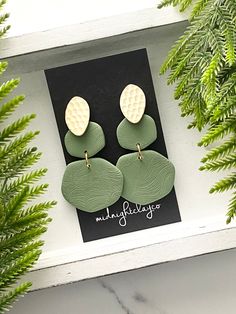 Handmade Polymer Clay Earrings You are looking at a pair of sage green polymer clay dangle earrings. Tiered organic shaped dangle earrings with matte gold plated oval shaped studs. Earrings are 2.5" in length. Gold plated jump rings. Nickel free! This minimalist style jewelry makes a great mothers day gift idea! A unique gift for daughter or women in your life! These are a best seller of 2023! MORE IN THIS COLLECTION: Shop more earrings in this collection in my greens section: https://www.etsy.c Minimalist Green Polymer Clay Earrings, Sage Green Earrings, Organic Earrings, How To Clean Earrings, Gifts For Daughter, Women Birthday, Earrings Minimalist, Birthday Gift For Her, Green Earrings