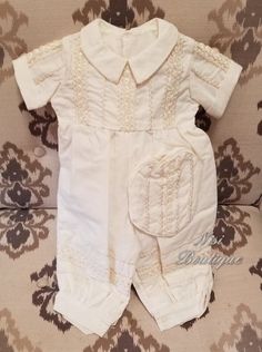 "Ivory Color 3 pieces Baby Boy Christening Outfit It is perfect for both baptism or blessing -Jumper -Sash -Hat Measurements 9-12 months, Jumper (waist 10\", long Shoulder to Hem 20\") 12-18 months, Jumper (waist 11\", long Shoulder to Hem 22\") 18-24 months, Jumper (waist 11.5\", long Shoulder to Hem 24.5\") Please check the measurements, and any questions send me a message, your satisfaction is very important for me Comes with a suit bag Dry clean only" Cream Short Sleeve Fitted Baptism Dress, Off White Baptism Dress For Summer, Cream Cotton Sets For Baptism, Cream Cotton Baptism Dress, Elegant Cream Short Sleeve Sets, Cream Short-sleeve Baptism Dress, First Communion Cream Baptism Dress, Fitted Beige Baptism Dress, Cream Sets For Baptism In Summer