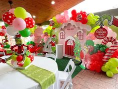 a room filled with lots of balloons and decorations