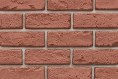 a brick wall that is made out of red bricks