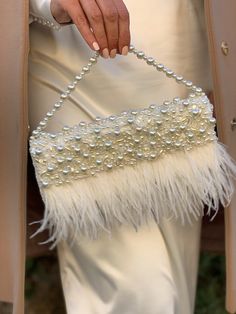 "Fancy slim wedding clutch is handmade and decorated with lace, pearl beads, and ostrich feathers embellishment on the front. The glamorous and vintage-looking small bridal handbag will be a great addition to your amazing look on the Special Day! The tiny elegant evening bag has a fold-over cover with sewn manually pearls, sequins, clear crystals, and ostrich feathers. The luxury handbag closes with a magnetic clasp. It will be a great accessory addition to the bride's outfit. The delicate women Elegant Cheap Evening Bag For Events, Affordable Glamorous Wedding Shoulder Bag, Luxury Cream Bags For Formal Occasions, Luxury Elegant Satchel For Formal Occasions, Luxury Party Bags With Fold Over Clasp, Luxury Pearl Embellished Evening Bag, Luxury Evening Clutch With Fold Over Clasp, Elegant Luxury Flap Bag With Fold Over Clasp, Luxury Chic Satchel For Party