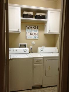 a washer and dryer sitting in a laundry room next to eachother