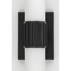 a black and white light fixture mounted on a wall