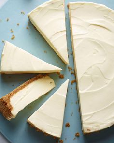 a piece of cake with white frosting on a blue plate