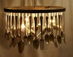 a chandelier with spoons and forks hanging from it