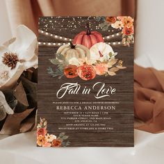 a fall wedding with pumpkins, flowers and string lights on the front of the card