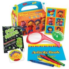 an assortment of children's toys including books, markers and pencils in a bag