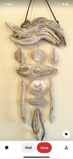 a driftwood wind chime with shells and seashells