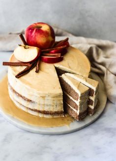 an apple cake with slices cut out on a plate