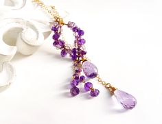 "One of a kind, precious amethyst with a dramatic deep purple hue lariat necklace. Enjoy the unique beauty of its elegant lariat design, crafted carefully to last for years to come. This necklace is sure to make a lasting impression. Video is shown how to wear like this lariat necklace ● Material 14K gold filled  ● Gemstone Amethyst - royal purple amethyst, pink amethyst , light amethyst  ● The length of the pendant is 2.5\"  (6.4cm) includes dangling beads, Teardrop size 17mm to 18mm ● Chain 18 Luxury Purple Necklace With Gemstone Beads, Elegant Long Drop Purple Jewelry, Elegant Purple Long Drop Jewelry, Luxury Drop Lariat Necklace As Gift, Luxury Drop Lariat Necklace Gift, Luxury Drop Lariat Necklace For Gift, Handmade Purple Lariat Necklace, Purple Long Drop Jewelry For Gift, Purple Long Drop Earrings For Gift