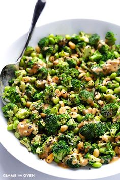 a white bowl filled with broccoli and chickpeas