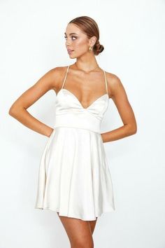 If you're looking for a fresh and approachable dress, the Aphrodite Champagne Satin Bustier Dress has you covered. It's great for a semi-formal occasion with its fitted bodice, plunge neckline, open back, and fit and flare silhouette. The champagne satin fabric gives it an unexpected touch of elegance you'll love. You can pair this dress with strappy high-heeled sandals and make a statement with a statement necklace. One to add to your wardrobe! DETAILS & CARE Polyester. Dry Clean. Imported. ORD Glamorous V-neck Dress With Corset Back, Summer V-neck Dress With Boned Bodice, Flirty V-neck Dress With Fitted Bodice, Flirty V-neck Prom Dress, Flirty V-neck Mini Dress With Fitted Bodice, Backless Corset Prom Dress For Prom Season, Fitted Bodice Backless Dress For Prom Season, Corset Back Backless Dress For Prom Season, Fitted Strapless V-neck Evening Dress