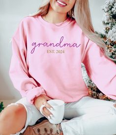 Personalized Grandma Est Date Sweatshirt, Custom Granny Sweater, Nana Sweatshirt, Grandma Sweatshirt, Mothers Day Gift for Grandma,  Hi There!  We use one of the best quality sweatshirt and hoodie brands out there! GILDAN Brand is super comfy, cozy and oh so soft! Here is some more info:  * All of our shirts are Unisex and our sizes are Retail Fit. Taped shoulder to shoulder and side seamed. * Size tag labels are the free tear away kind so say bye to that unwanted itching!  So how will you order Pink Crew Neck Sweatshirt For Mother's Day, Long Sleeve Tops For Mother's Day Loungewear, Crew Neck Tops With Name Print For Loungewear, Crew Neck Top For Mother's Day Loungewear, Crew Neck Top For Loungewear On Mother's Day, Relaxed Fit Pink Top With Lettering, Crew Neck Top For Loungewear, Winter Name Print Top As Gift, Name Print Tops As Winter Gift