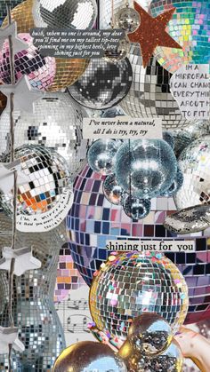 disco balls are stacked on top of each other in front of the words shine just for you