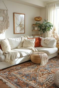 a living room filled with lots of furniture and rugs on top of a hard wood floor