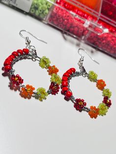 Beautiful Autumn color earrings, for any occasion, gift for her, colorful, light weight hoop earrings. Orange Hoop Earrings With Colorful Beads For Gift, Handmade Multicolor Clip-on Earrings For Party, Multicolor Dangle Earrings For Valentine's Day, Handmade Orange Hoop Earrings, Valentine's Day Multicolor Dangle Earrings, Color Earrings, Beautiful Autumn, Jewelry Earrings Hoops, Fall Colors