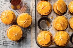 an image of oranges being baked in muffin tins on a tray with forks