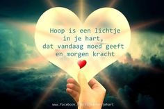 a person holding up a paper heart with the words hope is een lihte in it