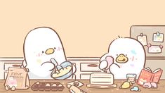 two stuffed animals sitting in front of a cake