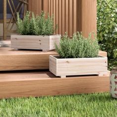 three wooden planters sitting on top of steps