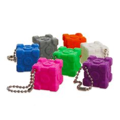 the lego blocks are all different colors and have chains attached to each one's sides