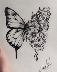 a drawing of a butterfly with flowers on it