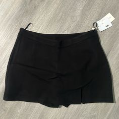 Black Skirt With Side Zipper. Brand New Tag Still On Never Been Worn. Short Skort With Built-in Shorts For Night Out, Trendy Black Mini Skirt With Built-in Shorts, Black Mini Skirt For Night Out With Short Inseam, Trendy Short Inseam Skort For Night Out, Trendy Skort For Night Out With Short Inseam, Casual High-waisted Skort For Night Out, Relaxed Fit Lined Skirt For Date Night, Trendy Skort For Night Out, Trendy Short Skort For Night Out