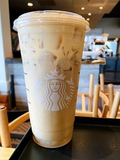 a starbucks drink sitting on top of a table