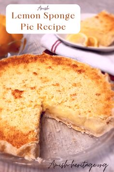 a lemon sponge pie on a plate with a slice cut out and ready to be eaten