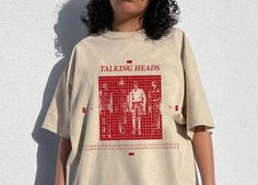 Vintage the smiths - Talking Heads More Songs About Buildings and Food Unisex Shirt Gift for men women unisex t-shirt : 100% Cotton (fiber content may vary for different colors) .: Medium fabric (5.3 oz/yd² (180 g/m .: Classic fit .: Runs true to size HOW TO ORDER Pick you favorite design. Review the size & color charts above FIRST and then select shirt size and color from the dropdown menu. Indicate the birthday year in the personalization box. Please note size measurements for t-shirts may differ +/- 1 inch due to the manufacturer. Colors may not exactly match what's shown on screen. Thanks for stopping by my shop. Feel free to reach out for any questions you may have. I appreciate your business. Clothes Wishlist, Fashion Reference, Trendy Boy Outfits, Food Shirt, Inspirational Tshirts, The Smiths, Boxing T Shirts, Talking Heads, Band Shirts