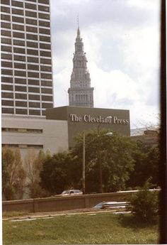 the cleveland press sign in front of a tall building