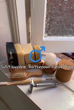 bathroom items sitting on top of a counter next to a window with an arrow pointing towards them