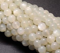 several white beads are stacked on top of each other, with the words regular price 544