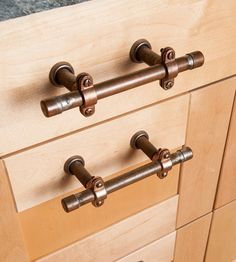 an image of wooden drawers with metal handles