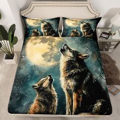 two wolfs looking up at the moon on a bed with pillows and comforters