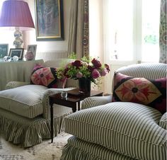 a living room filled with furniture and flowers