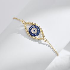 sterling silver 925 gold bracelet filled with 18k Elegant Adjustable Jewelry With Diamond Eyes, Gold Sterling Silver Bracelet In Fine Jewelry Style, Spiritual Gold Bracelets With Evil Eye, Elegant Gold Evil Eye Bracelet With Diamond Eyes, Elegant Gold Evil Eye Bracelet With Diamond Details, Elegant Gold Plated Evil Eye Bracelet, Elegant Evil Eye Bracelet With Diamonds As Gift, Elegant Evil Eye Bracelet With Adjustable Chain, Elegant Evil Eye Bangle Jewelry