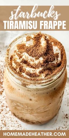 a mason jar filled with hot chocolate and whipped cream, topped with cinnamon sprinkles