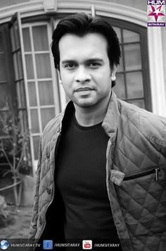 a black and white photo of a man in front of a house with the caption's name on it