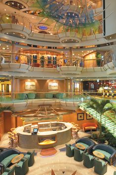 the inside of a large cruise ship with lots of seating