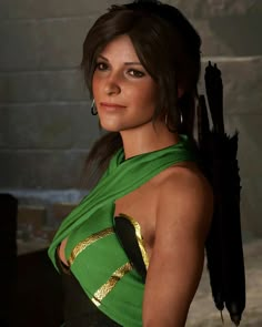 a woman in a green dress with feathers on her head and one arm around her neck