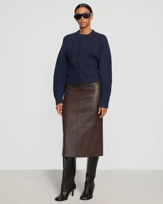 Our updated take on the classic cable-knit cardigan. A thick, shape-holding knit reimagined in a contemporary fit. Pair with a chic leather skirt, or dress her down with your go-to denim. See below for our general Size Guide and available measurements Made of 60% cotton 30% nylon and 10% wool Hand wash cold and lay flat to dry Vegan Leather Skirt, Cable Cardigan, Chic Leather, Self Made, Cable Knit Cardigan, Cozy Sweater, Night Looks, Split Hem, Cozy Sweaters