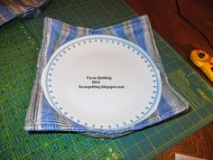 a white plate sitting on top of a green cutting board next to a pair of scissors