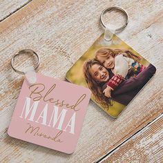 a keychain with an image of two people on it and the words, blessed mama